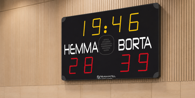 Stramatel resultattavla med Hemma och Borta på väggen i en idrottshall.
